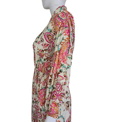 Floral patterned wrap style dress on a light background