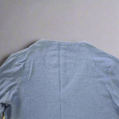 Blue fabric on a beige tiled floor