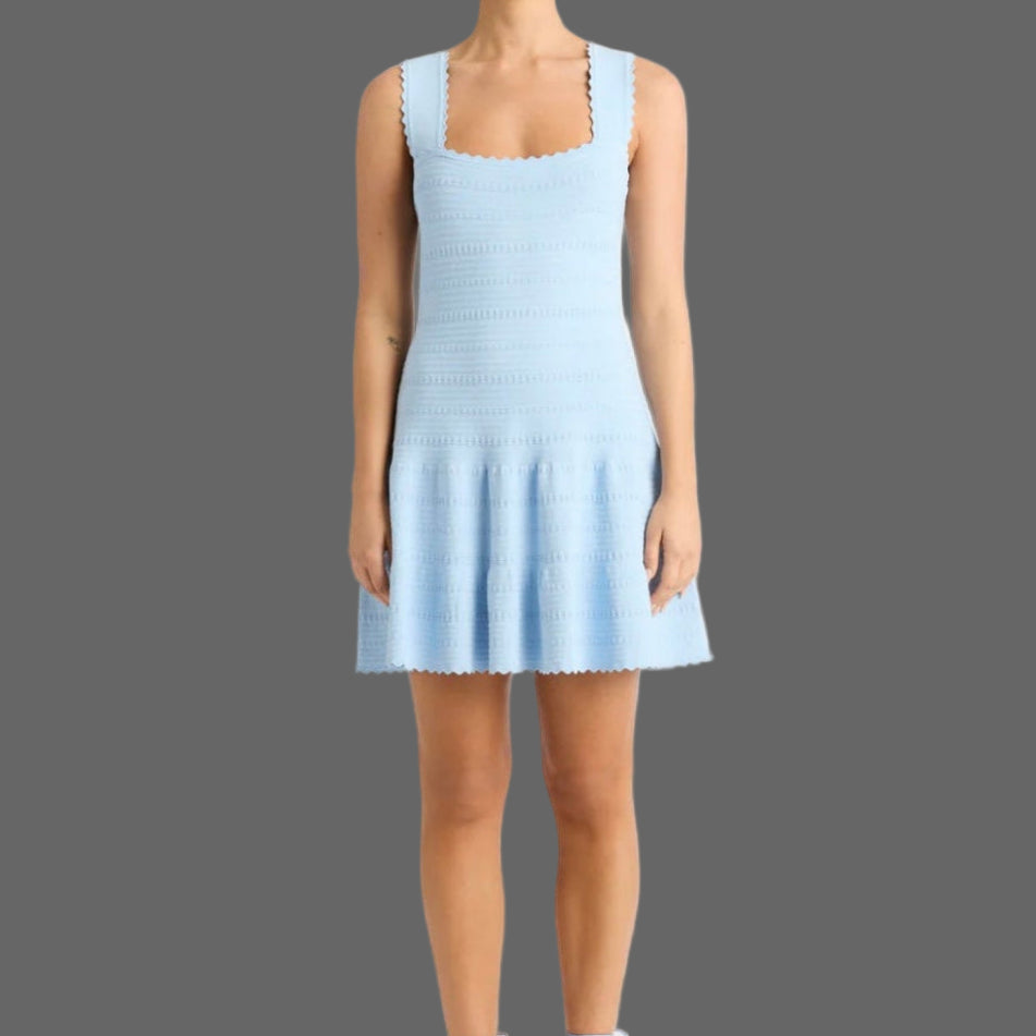 Light blue dress worn by a model on a white background