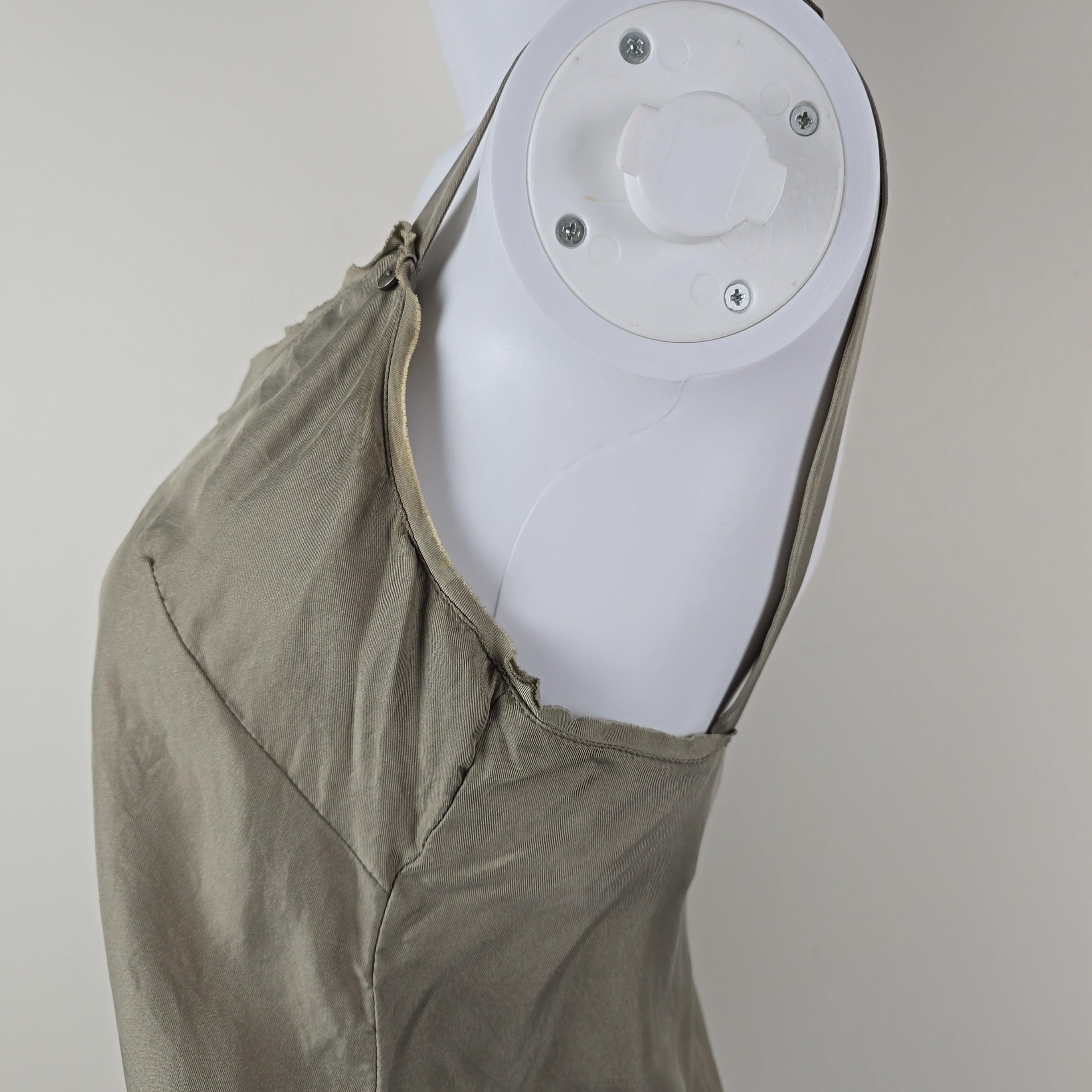 Close-up of a grey top on a light gray background