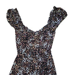 Leopard print dress on a light background