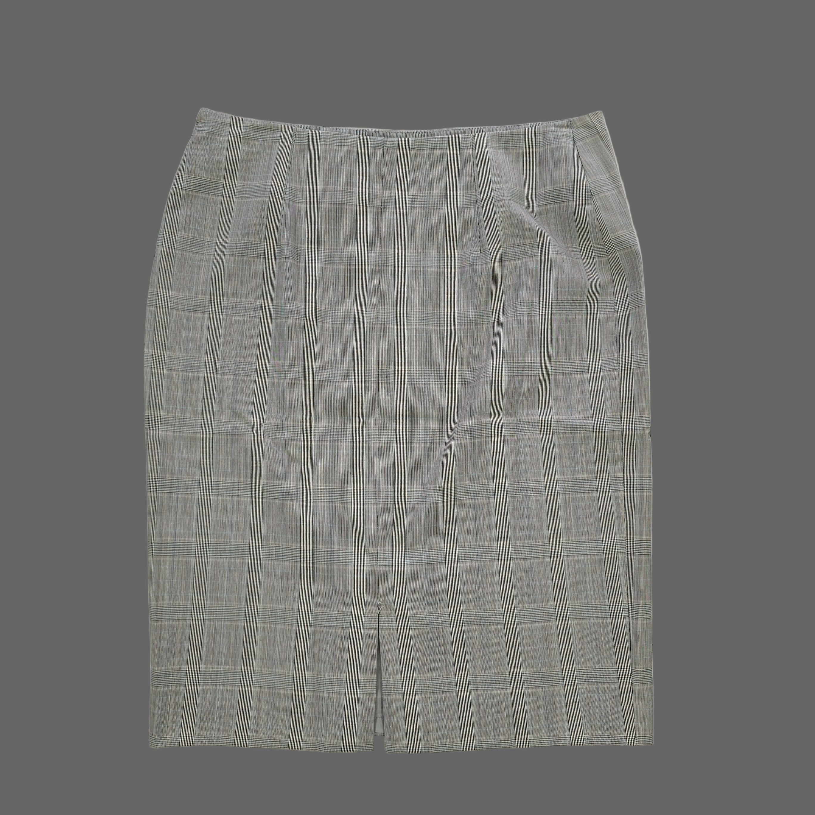 Gray checkered skirt on a tiled floor