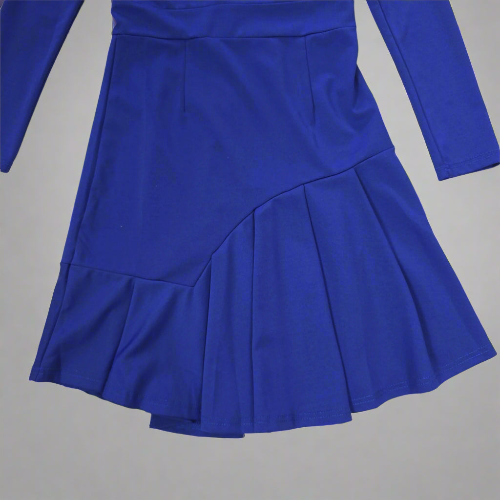 Blue pleated dress on a tiled floor