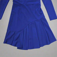 Blue pleated dress on a tiled floor