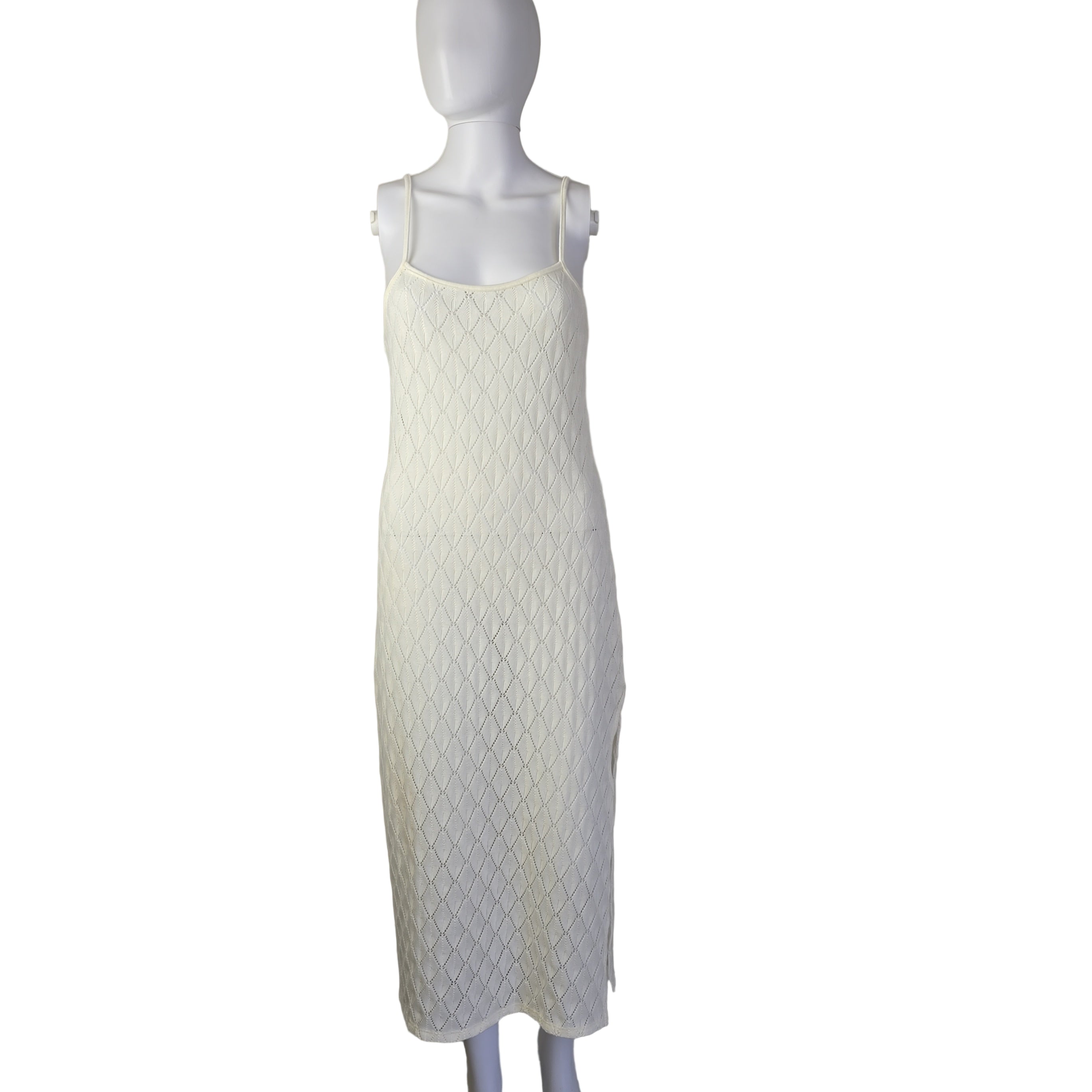 White textured dress on a light background.