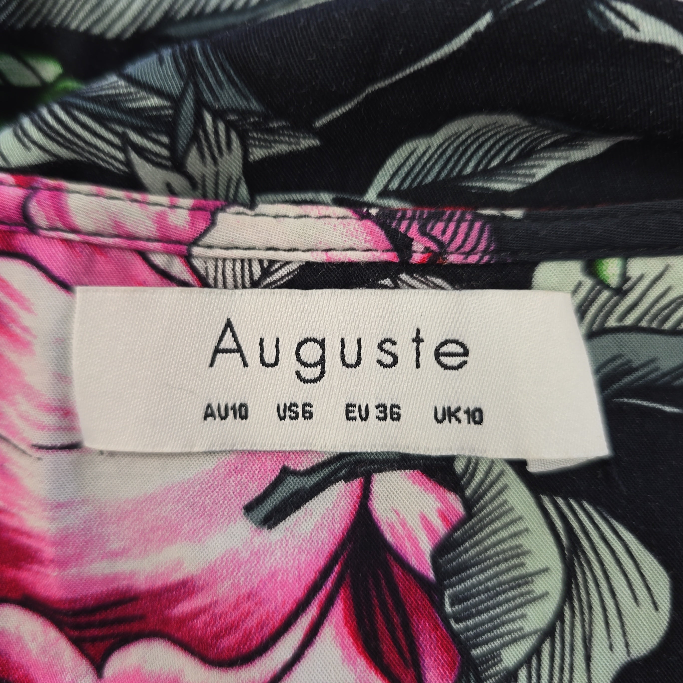 Fabric with a floral pattern and an 'Auguste' label.