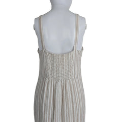 Mannequin wearing a textured dress with a neutral background