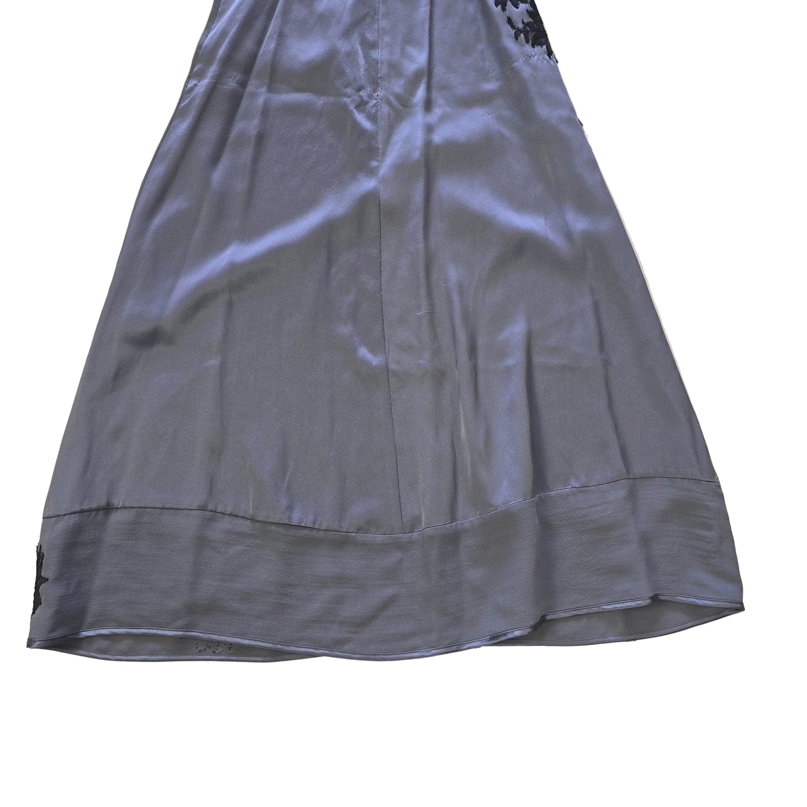 Grey dress with black floral patterns on a light background.