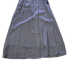 Grey dress with black floral patterns on a light background.