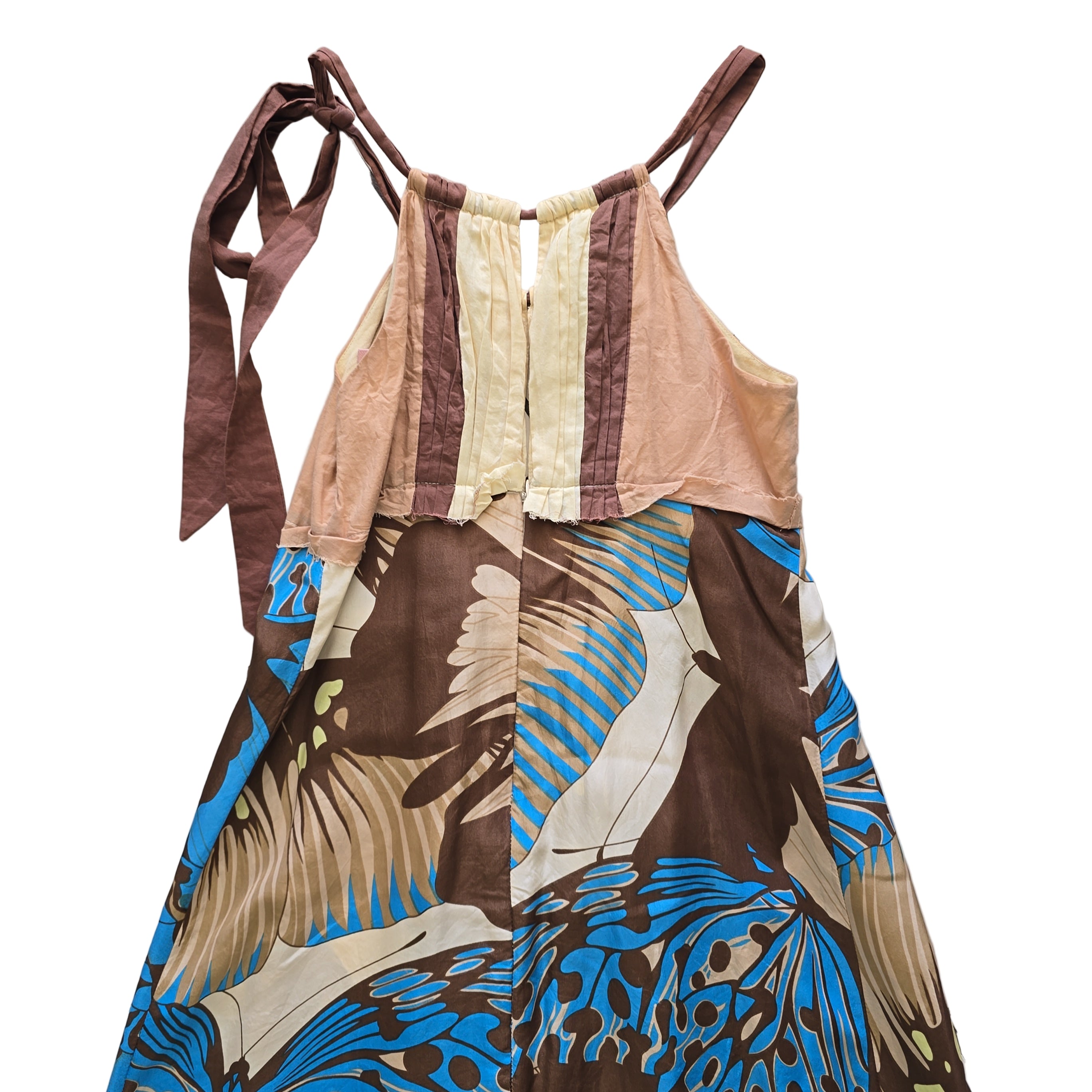 Colorful dress with abstract patterns on a tiled floor