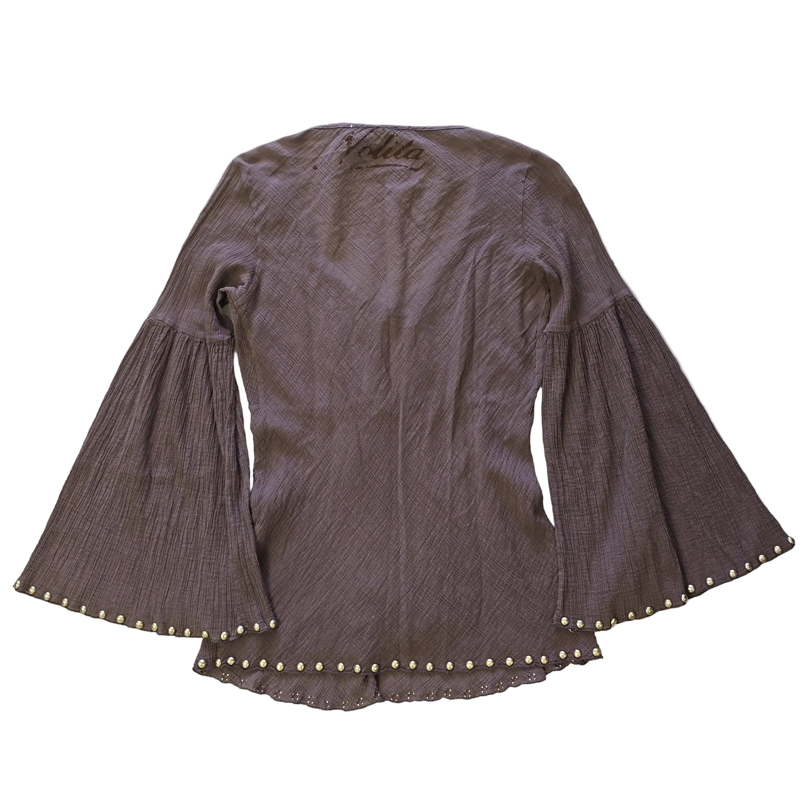 Brown textured fabric with decorative studs on a light background