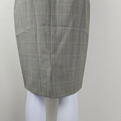 Gray checkered skirt roll on a mannequin with a plain background