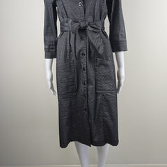 Black denim dress on a mannequin against a plain background