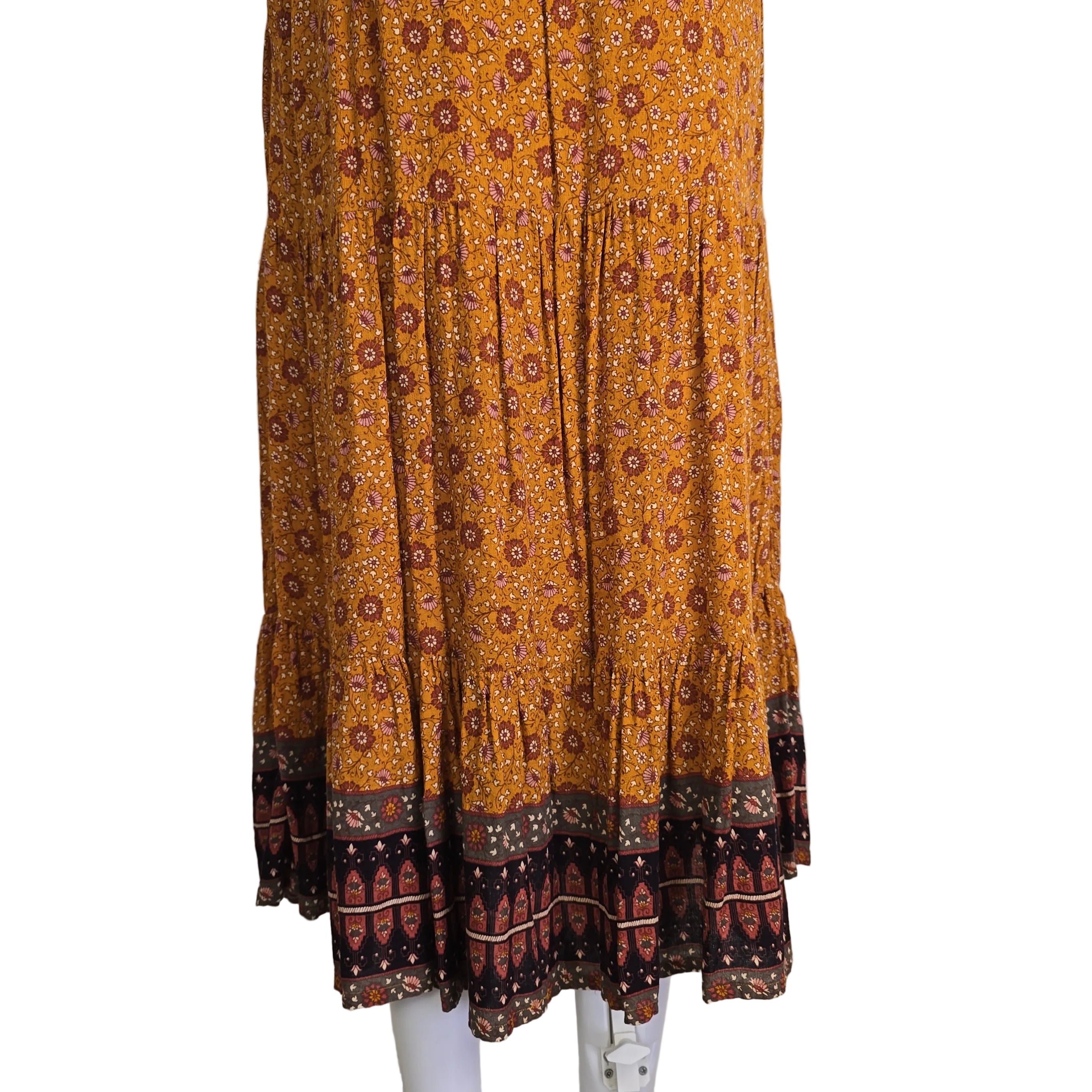 Brown patterned maxi skirt on a light background