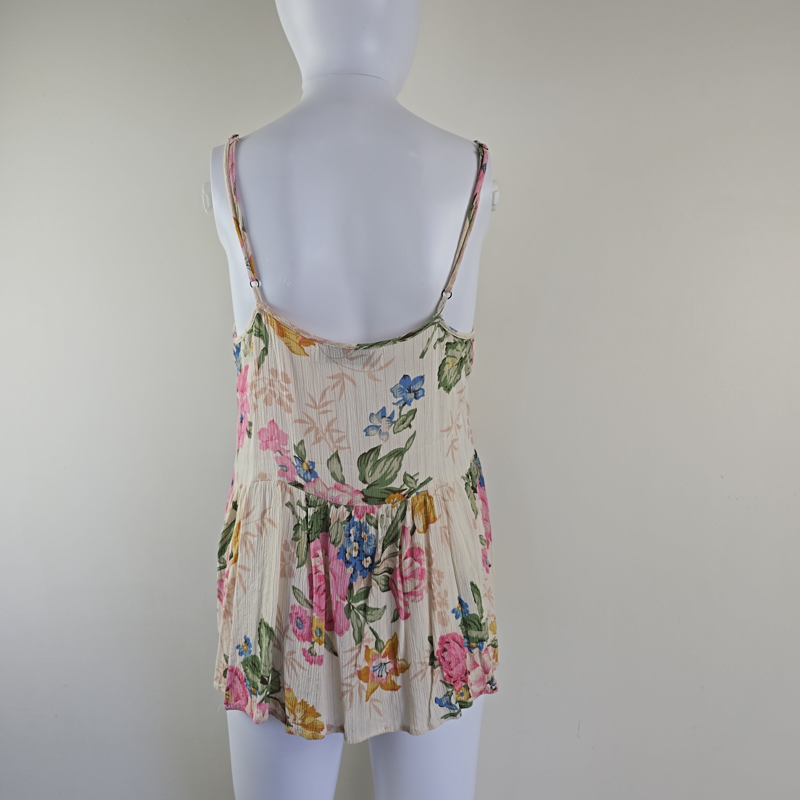 Cream floral top on a light background