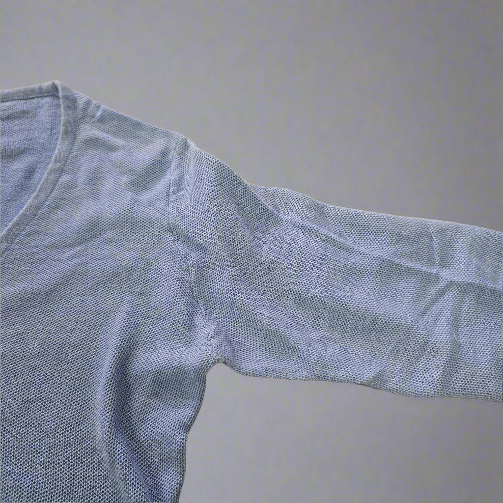 Blue textured fabric on a beige surface