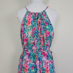 Floral strapless dress on a mannequin against a plain background