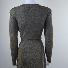 Black and gold textured dress on a mannequin against a light gray background