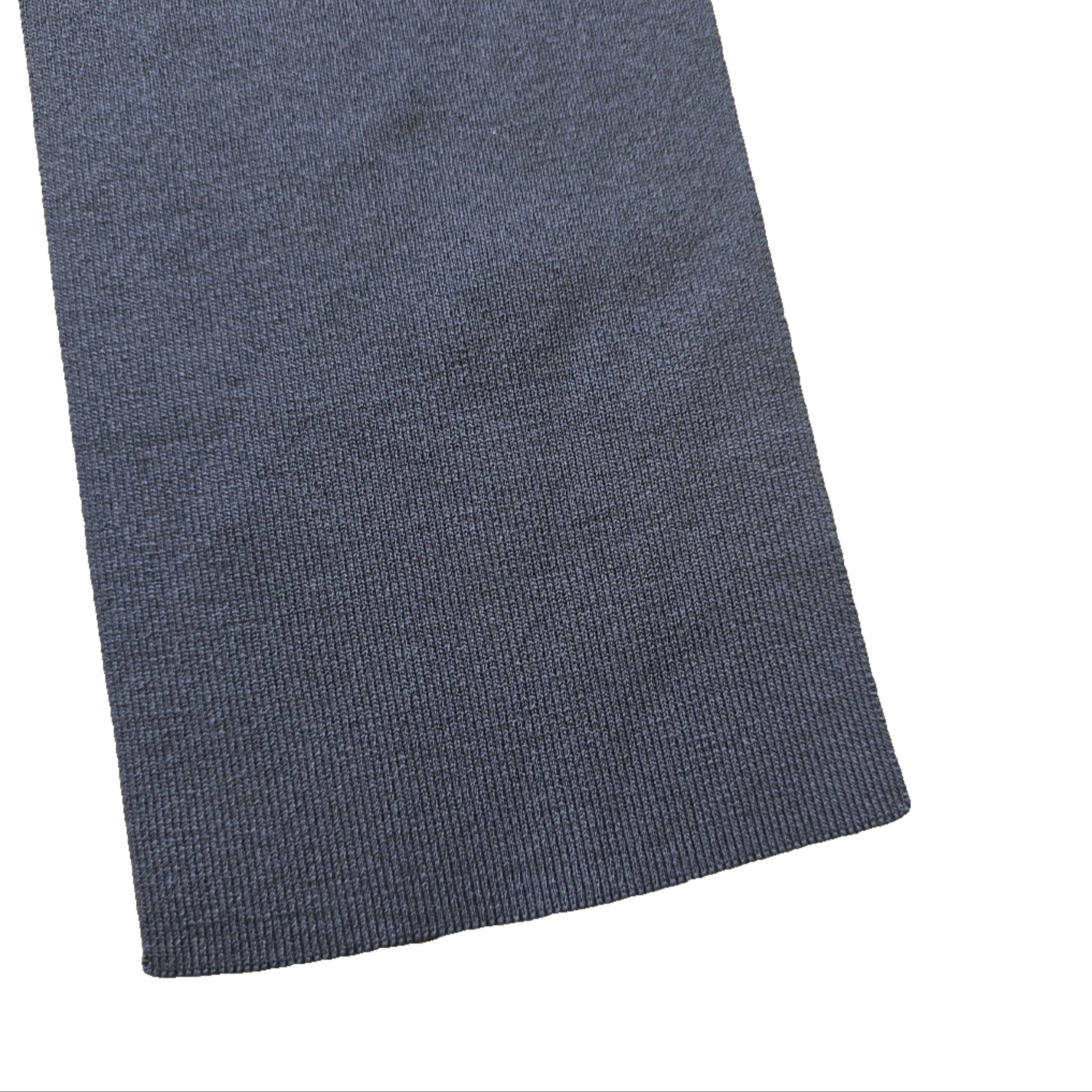 Grey textured fabric on a beige tiled floor