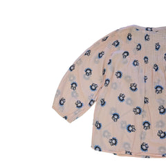 Floral-patterned flowy top on a light background