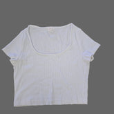 White t-shirt on a tiled floor