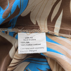Close-up of a fabric with a pattern and a label on it.