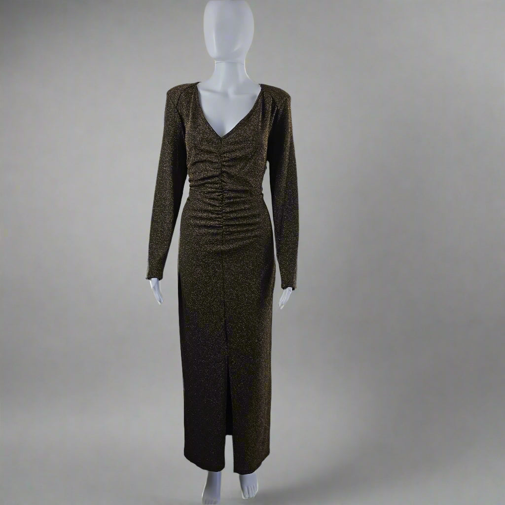 Black and gold textured dress on a mannequin against a light gray background