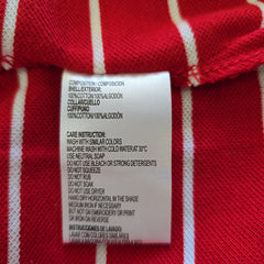 Close-up of a label on a red and white striped fabric