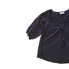 Brown long-sleeve top on a light background