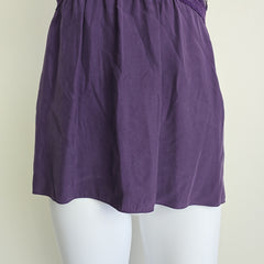 Purple lace-trimmed top on a light background