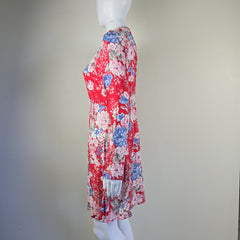 Floral-patterned headband on a mannequin against a plain background