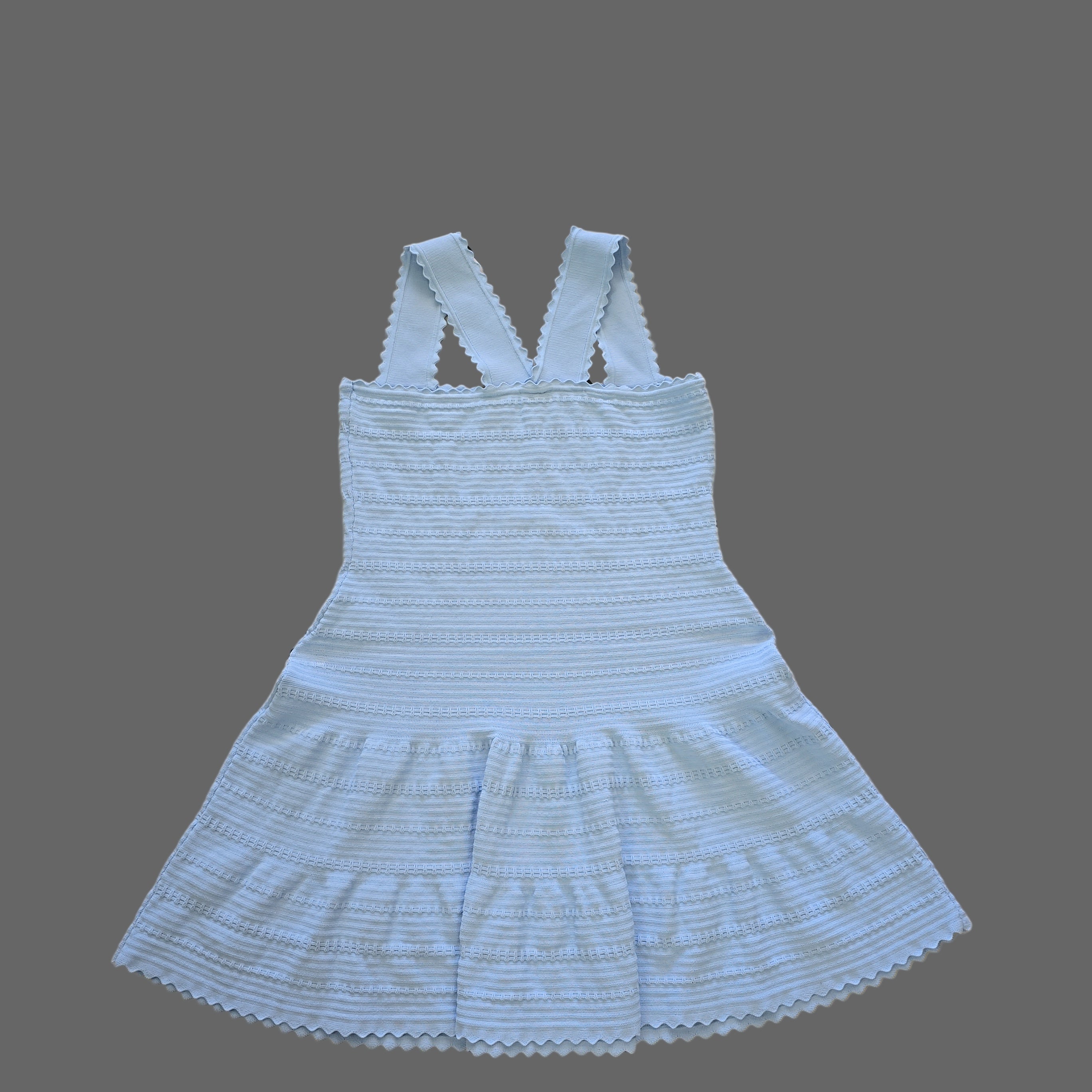 Light blue ribbed dress with thin straps on a tiled floor