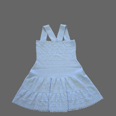 Light blue ribbed dress with thin straps on a tiled floor