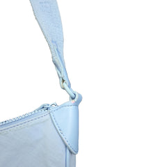 Close-up of a light blue strap and zipper on a light background