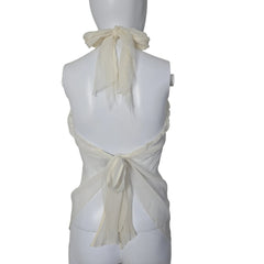 Mannequin wearing a white top with sheer sleeves against a plain background