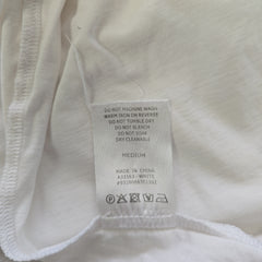 Close-up of a clothing label on a white fabric background