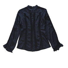 Black long sleeved button up top with black lace details on a light background