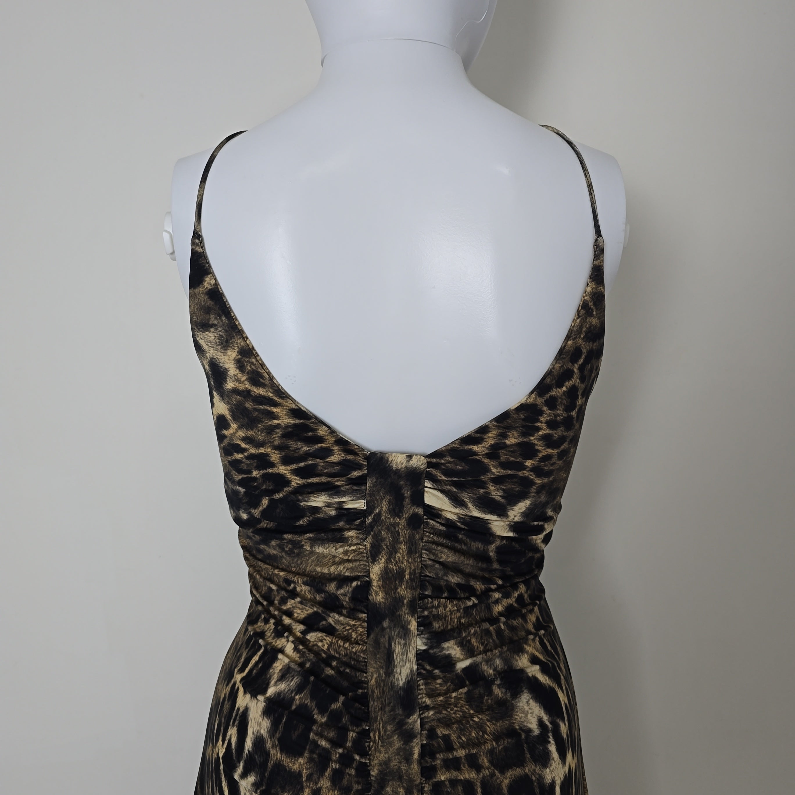 Leopard print dress on a mannequin against a plain background