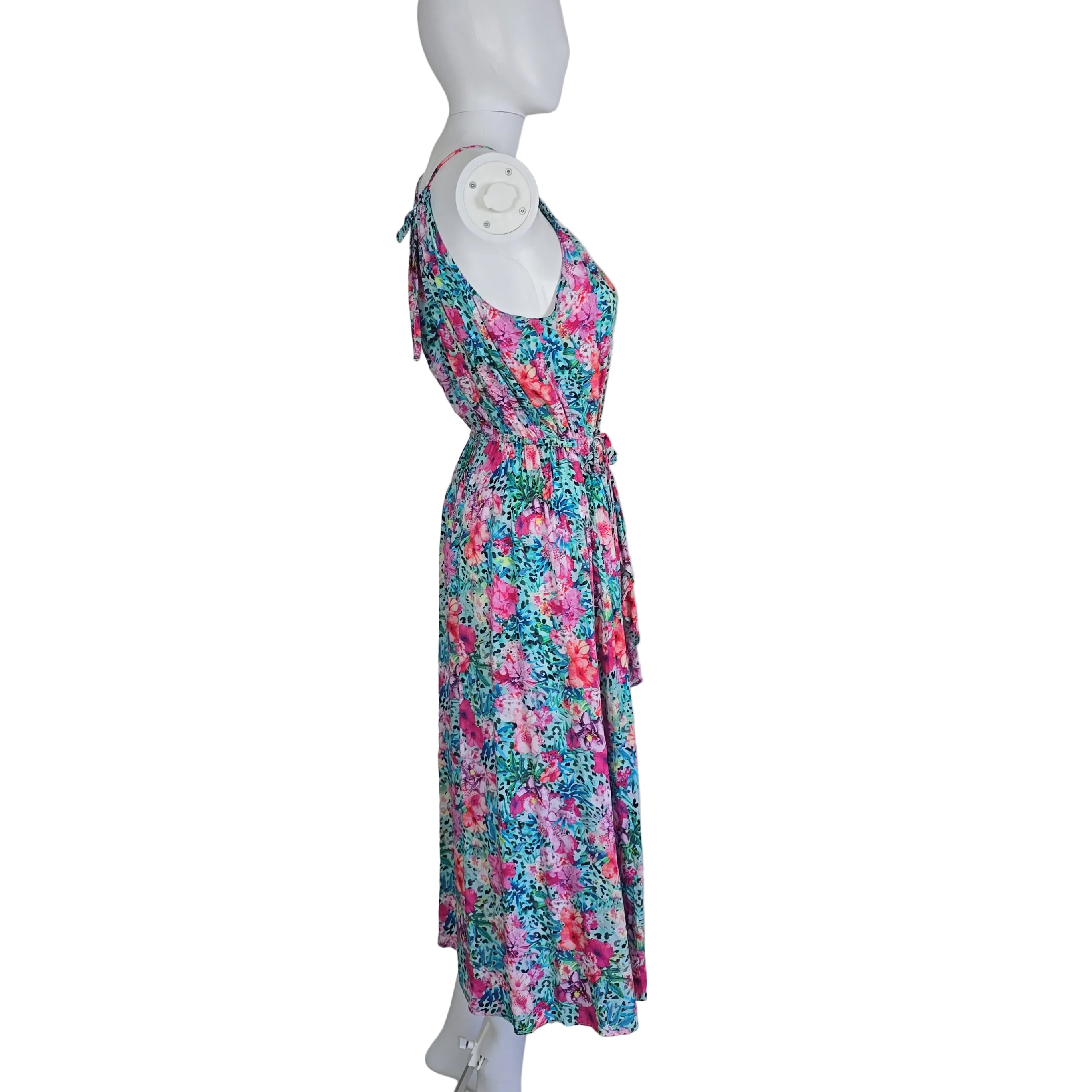 Floral-patterned dress on a mannequin against a white background