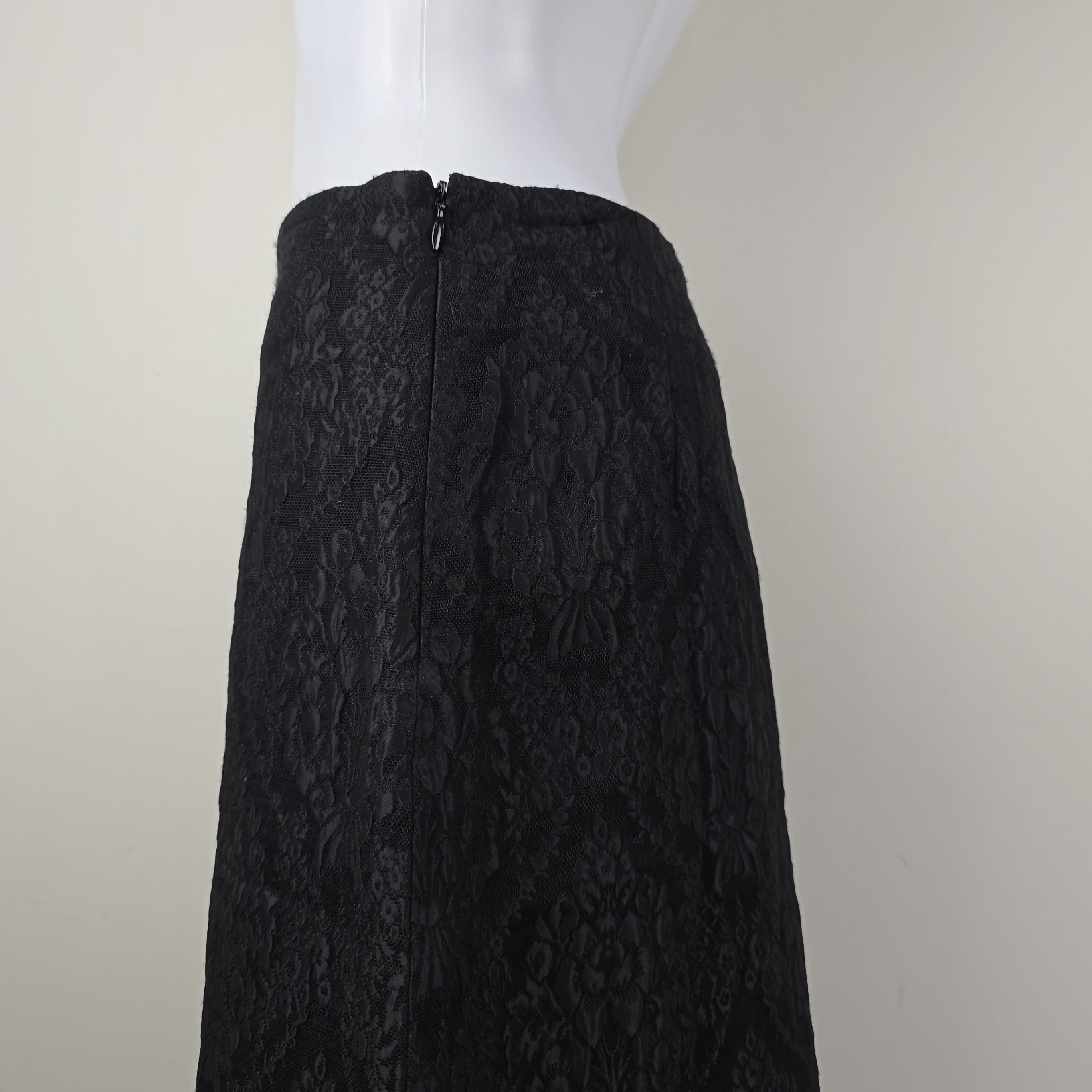 Black textured skirt on a white background