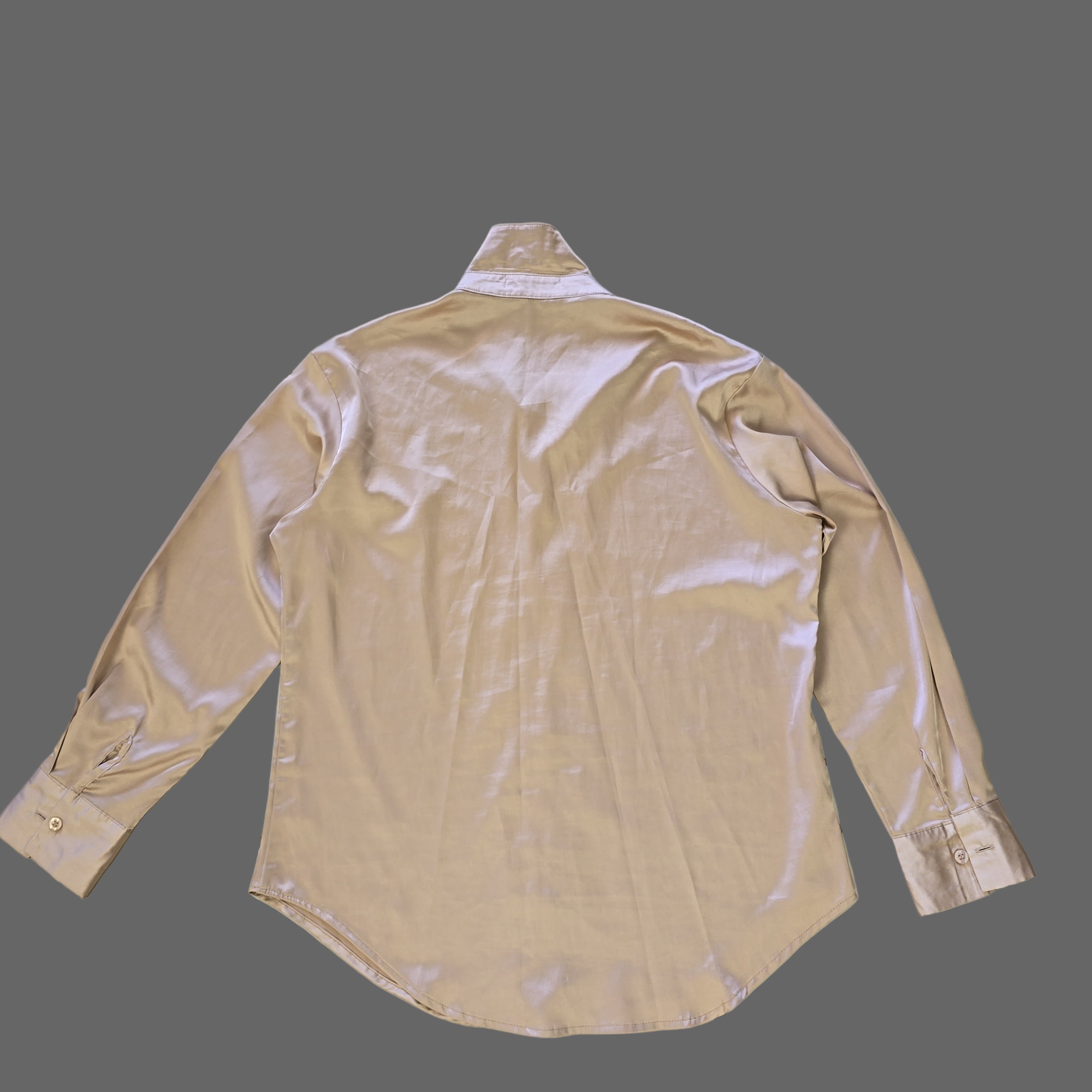 Beige long-sleeve shirt on a tiled floor