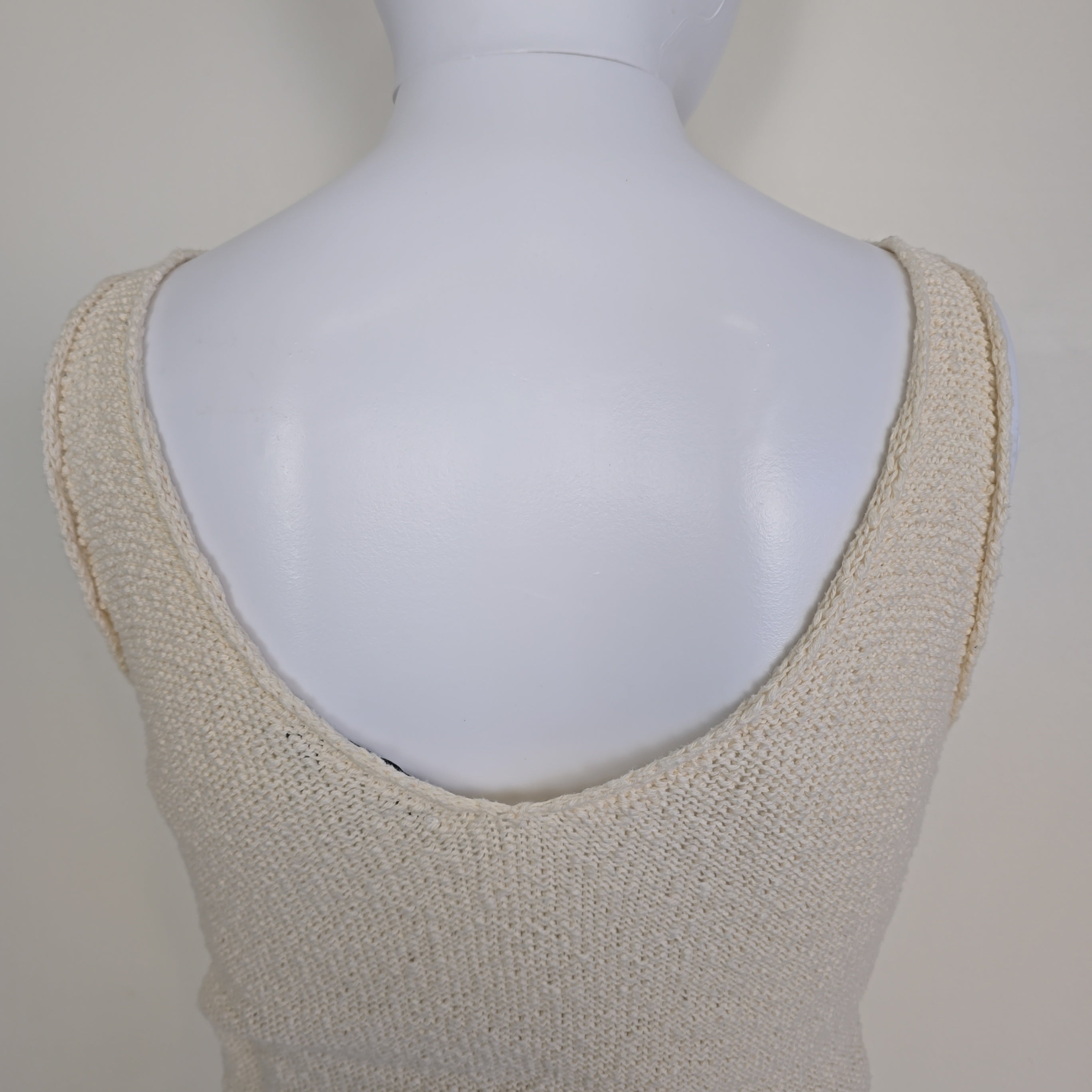 White knitted tank top on a light background