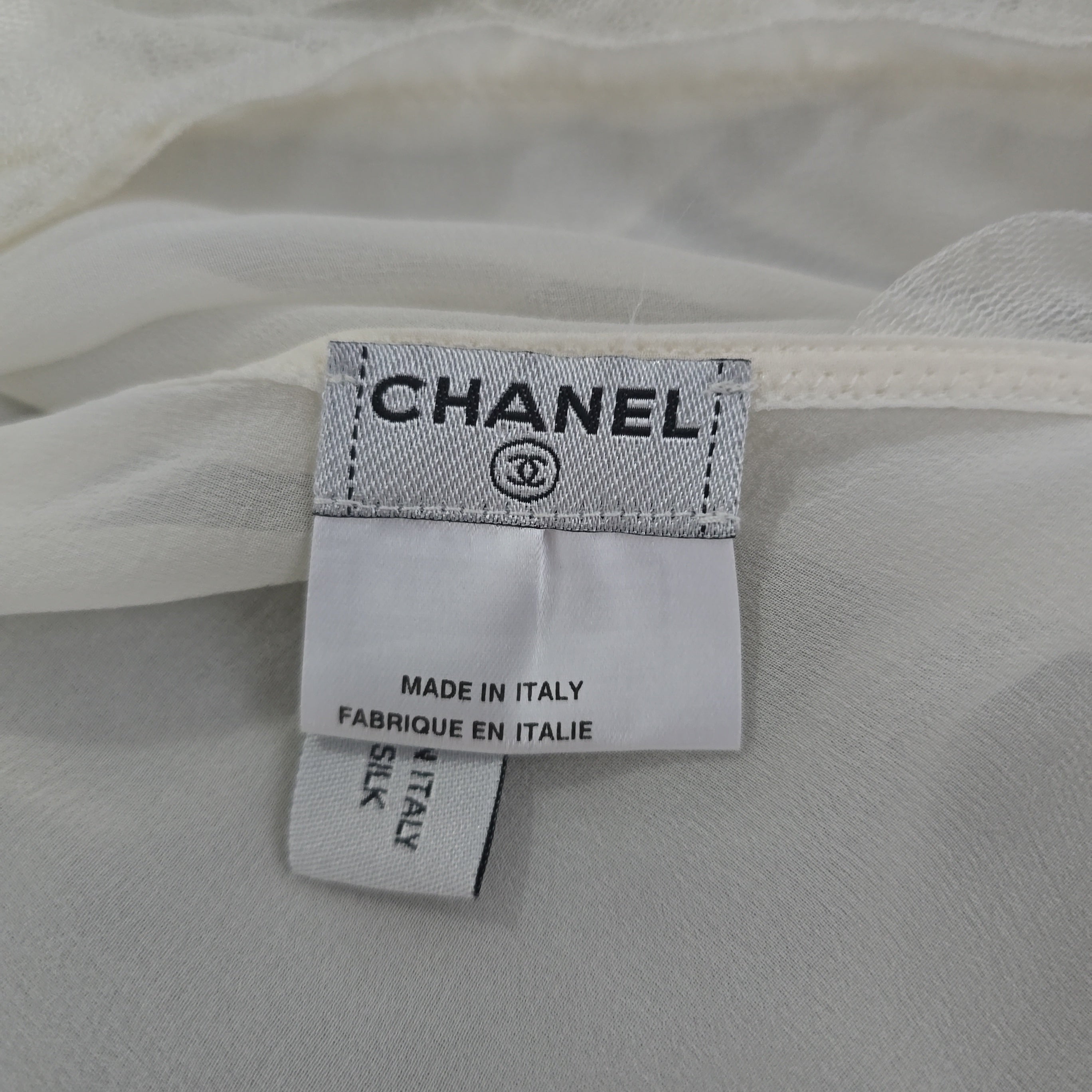Chanel label on a silk fabric background