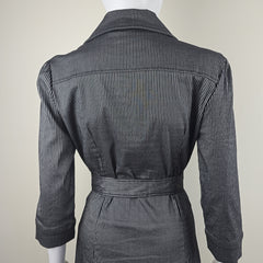 Black pinstripe suit jacket and pants on a mannequin against a white background