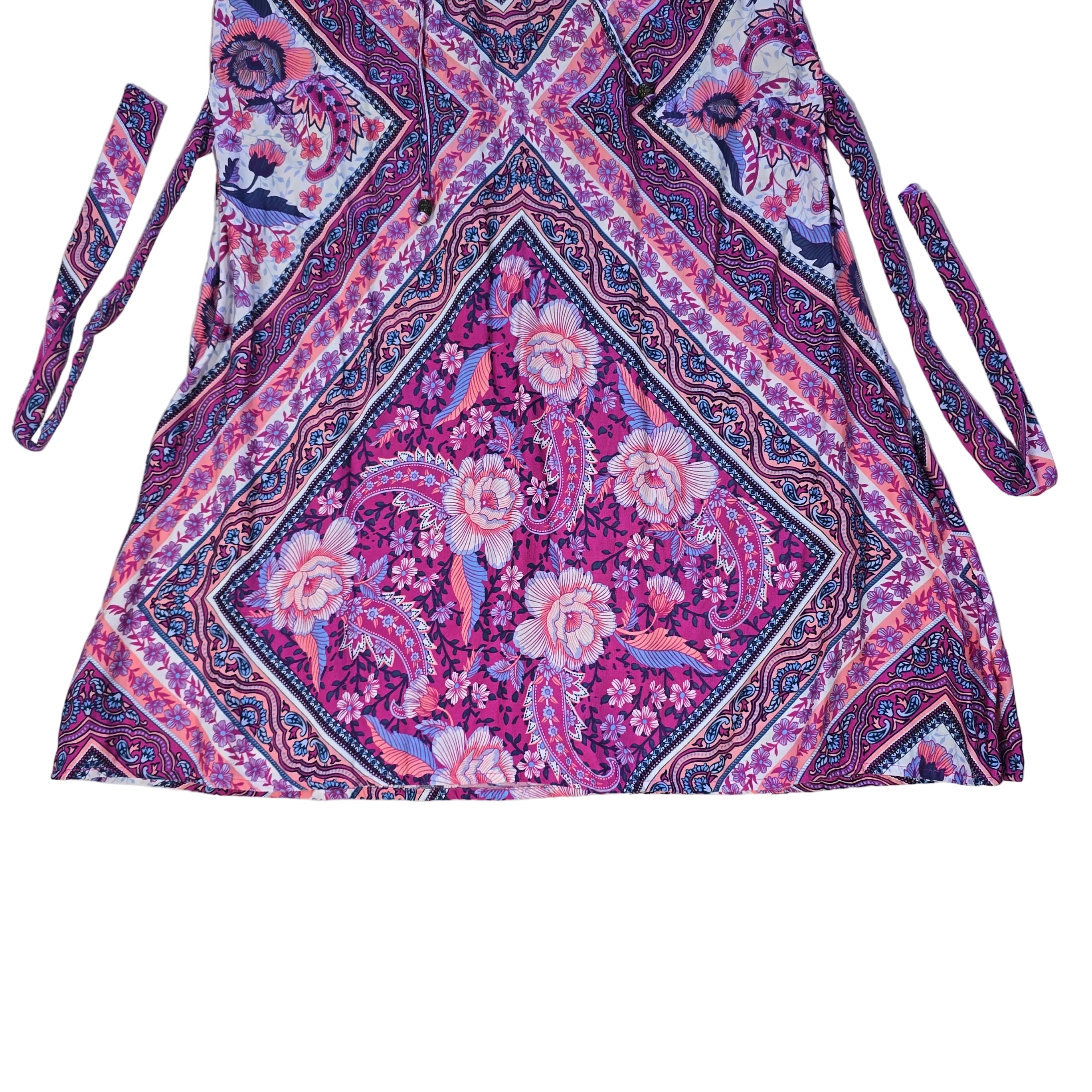 Pink and purple patterned dress on a light background