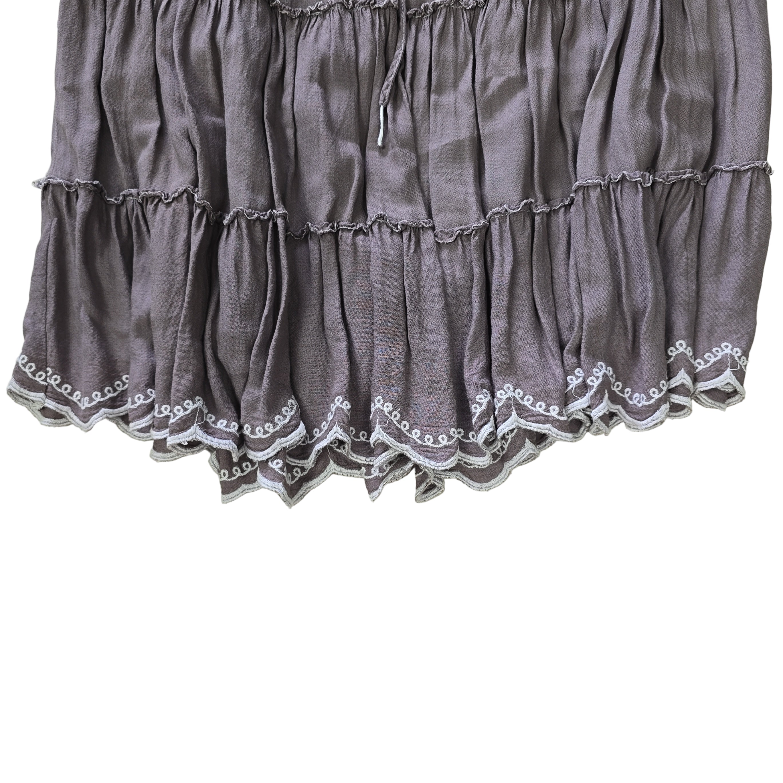 Gray skirt with lace trim on a light background