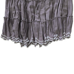 Gray skirt with lace trim on a light background