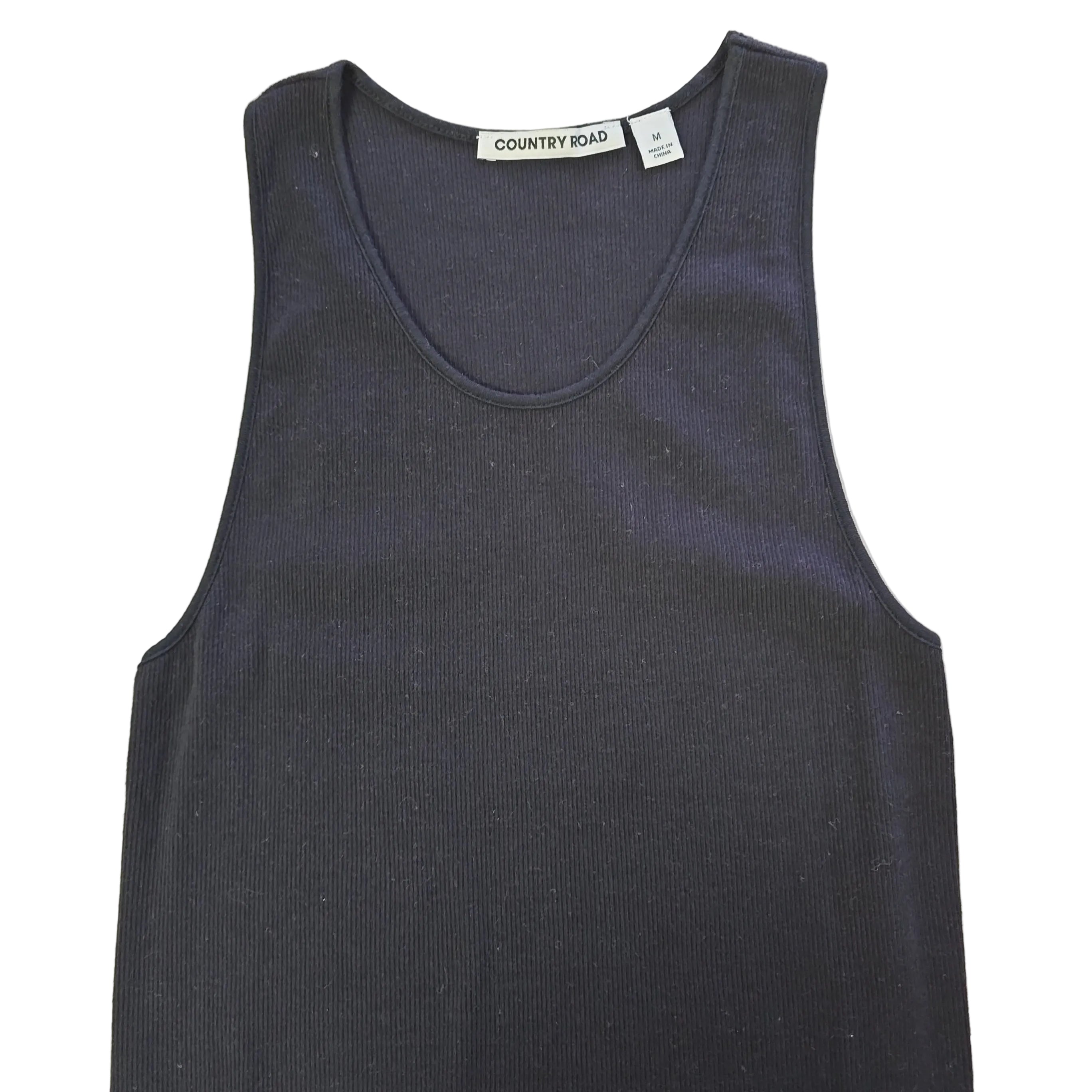 Black sleeveless top on a light background