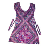 Pink and purple patterned dress on a light background