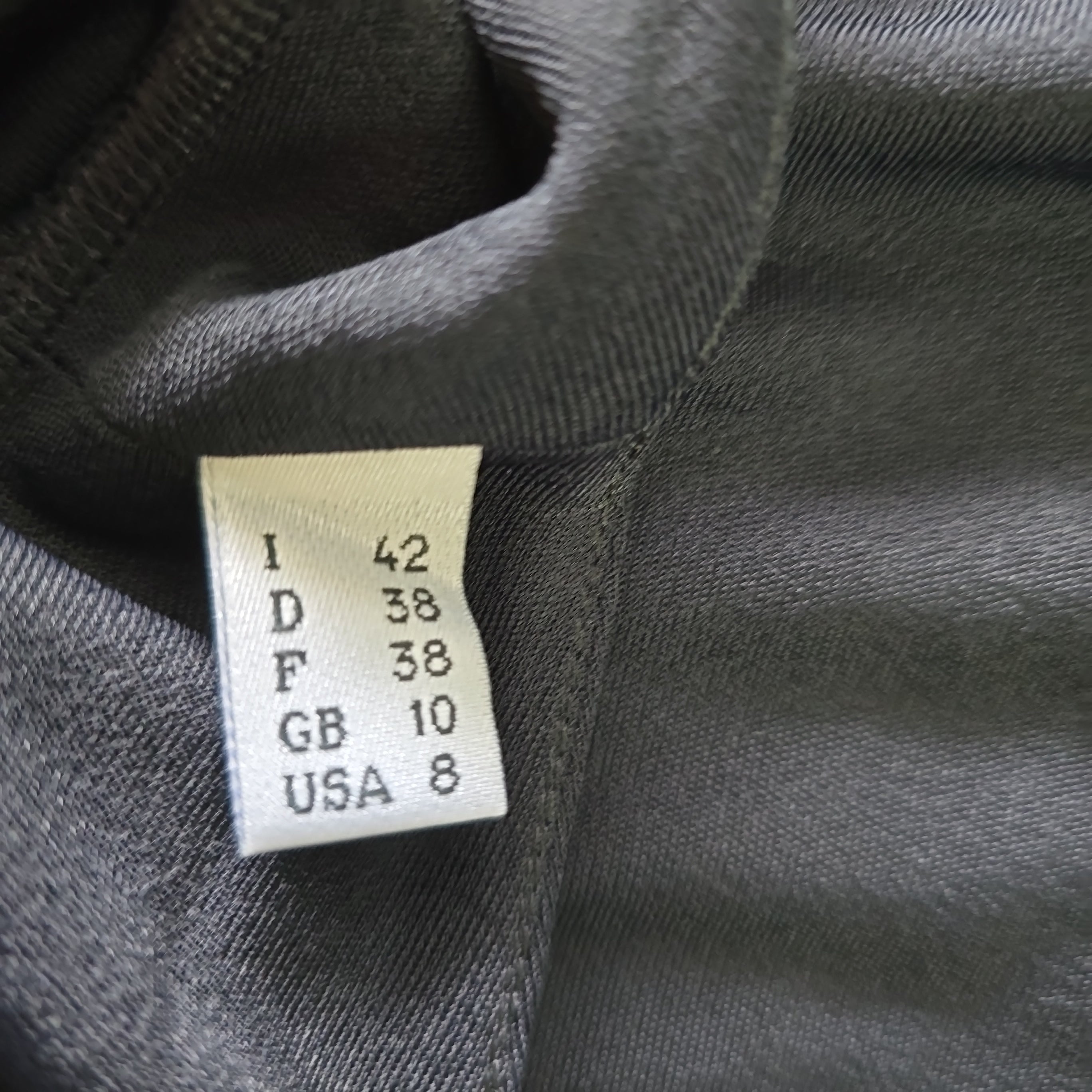 Clothing label on a dark fabric background